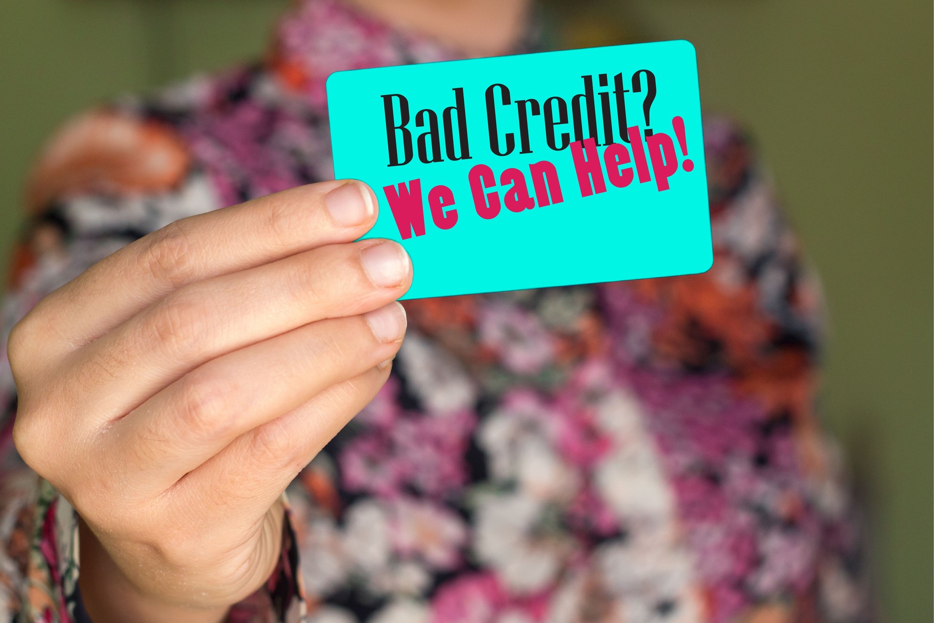 Business Man Pointing the Text: Bad Credit? We Can Help!